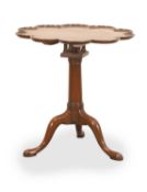 A tilt top wine table with a piecrust top 19th century,