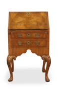 A small walnut bureau, 19th century,