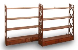 A pair of fruitwood Regency style hanging wall shelves, 20th century,