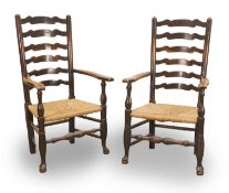 Two Lancashire oak ladderback elbow armchairs, 19th century,