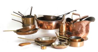 A collection of copper pans and vessels,