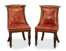 A pair of Regency mahogany bergere library chairs, circa 1825,