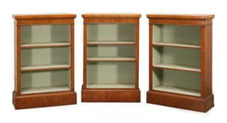 Three walnut and oak banded open front bookcases, of modern manufacture,