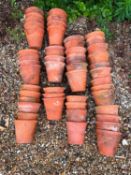 A large quantity of teracotta garden pots, By G&A Tuck Waltham Abbey Pottery,