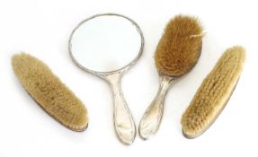 A silver handled brush set,