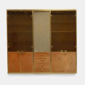 Manner of Renato Zevi, a brass and orange suede wall cabinet,