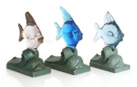 A set of three Art Deco glass and spelter paperweights, 1930s,