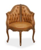 A walnut and leather button-back chair,