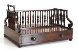 A Regency rosewood double sided book trough, 19th century,