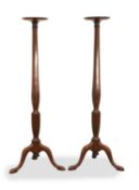 A pair of mahogany torchere stands, 19th century,