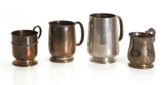 A collection of silver mugs,