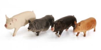 A collection of Beswick pigs and a boars, 20th century,
