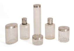 A set of Art Deco silver mounted glass vanity jars,