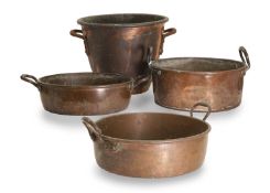 A collection of four copper pans, 19th century,