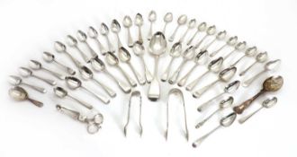 A collection of silver teaspoons and flatware,