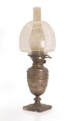 A silver cased oil lamp,