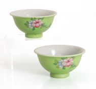 A pair of Chinese sgraffito green-ground famille rose tea bowls,