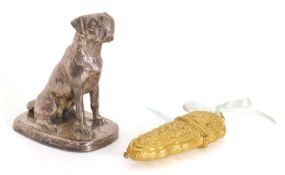 A silver cased resin dog,