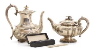 Two silver teapots,