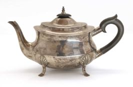 A silver teapot,