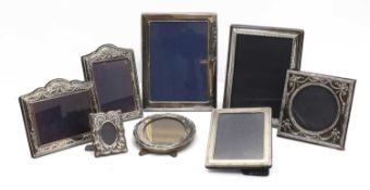 A group of silver photograph frames,