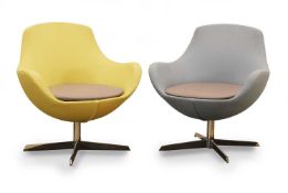 Two Herman Miller tub swivel chairs, of modern manufacture,