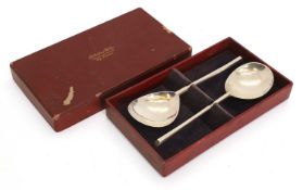 A pair of silver spoons,