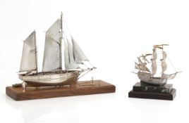 A silver resin cased model of a galleon,