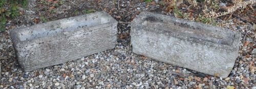 A pair of rectangular composite planters,