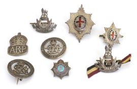 Two Coldstream Guards silver and enamelled cap badges,