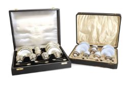 Two cased silver mounted porcelain coffee services, early 20th century,