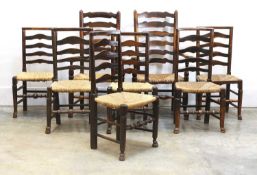 A set of six George III country made ladder back chairs,