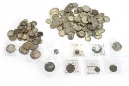 A collection of silver coins,