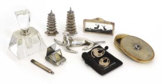 A pair of Chinese silver pagoda form pepperettes, circa 1900,