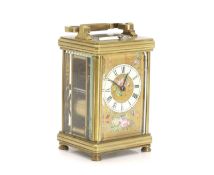 A brass carriage clock, inscribed 'W Gibson & Co Belfast & Paris',