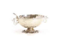 A silver bowl and spoon, early 20th century