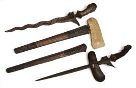Two Indonesian kris daggers with scabbards, 19th century,