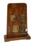 An Aubin's Patent A1 Guardian Safe Lock, downward locking, with one original key, mounted on an