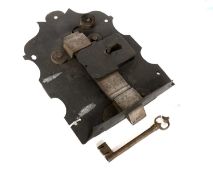 A 17th Century English Draw Back Lock, shaped back plate, warded lock with key outside, slide knob