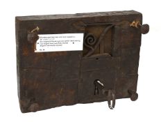 An Early 18th Century Oak-Cased Door Lock, with finely warded key, the key stepped at a bit end to