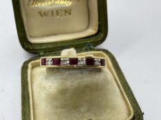 RUBY AND DIAMOND HALF-ETERNITY RING SET IN YELLOW METAL TESTED AS GOLD