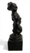 An early 20th century patinated bronze young laughing faun on a black marble base