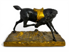 A 19th century French Restauration period gilt bronze and patinated model of a horse