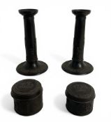 A pair of late 19th / early 20th century Wedgwood basalt candlesticks and matched pair of pots and c