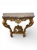 A Louis XV style carved giltwood serpentine console table