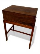 A mid century Danish Indian rosewood work box on stand inlaid with brass lines