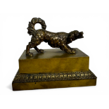 A 19th century French bronze encrier or inkwell in form of a curly coated spaniel
