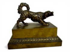 A 19th century French bronze encrier or inkwell in form of a curly coated spaniel