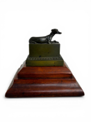 A 19th century French gilt bronze and patinated encrier or inkwell in form of a seated greyhound