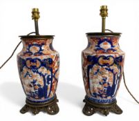 A pair of late 19th century Imari porcelain vases converted to table lamps